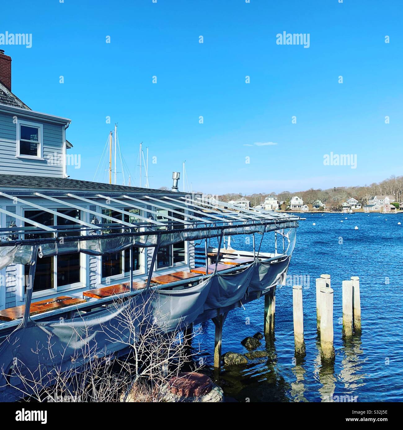 Winter view of a building on the water Woods Hole, Falmouth, Cape Cod, Massachusetts, United States - Smartphone Captured Stock Image