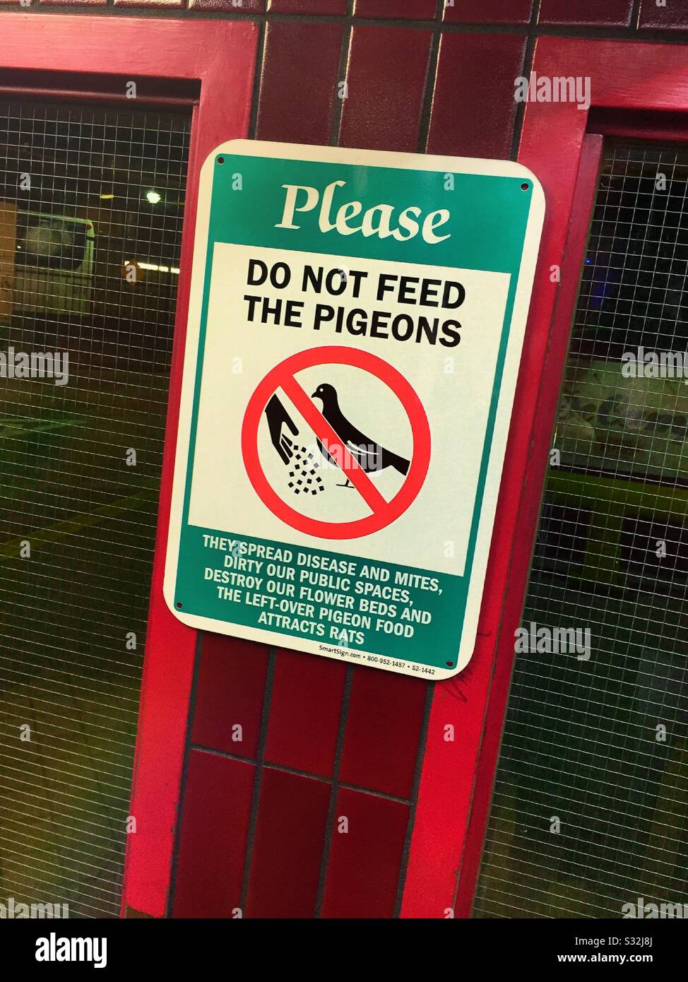 Please do not feed the pigeons sign, USA - Smartphone Captured Stock Image