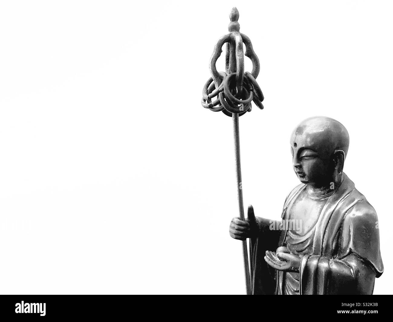 Jizo Bodhisattva on a white background. - Smartphone Captured Stock Image