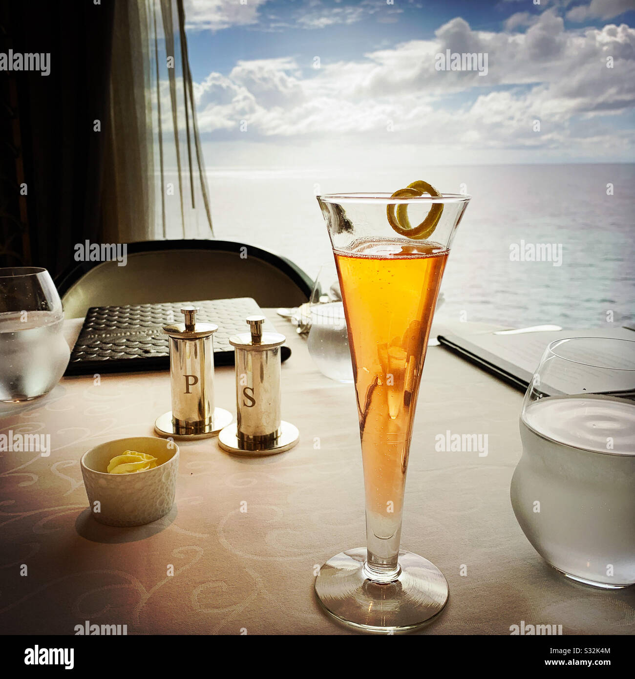 Enjoying a drink during a lunch at sea - Smartphone Captured Stock Image