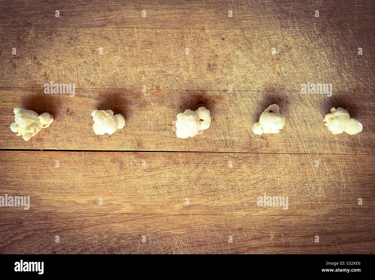 Popcorn on wooden background. Stock Photo