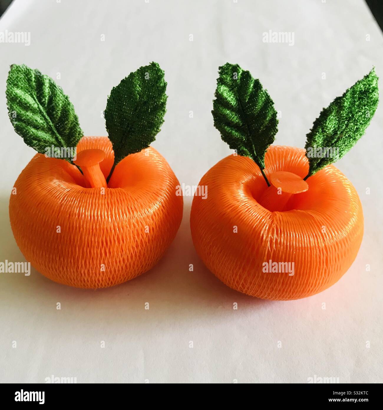 Handmade two mandarin oranges in a white background, Symbol of Chinese