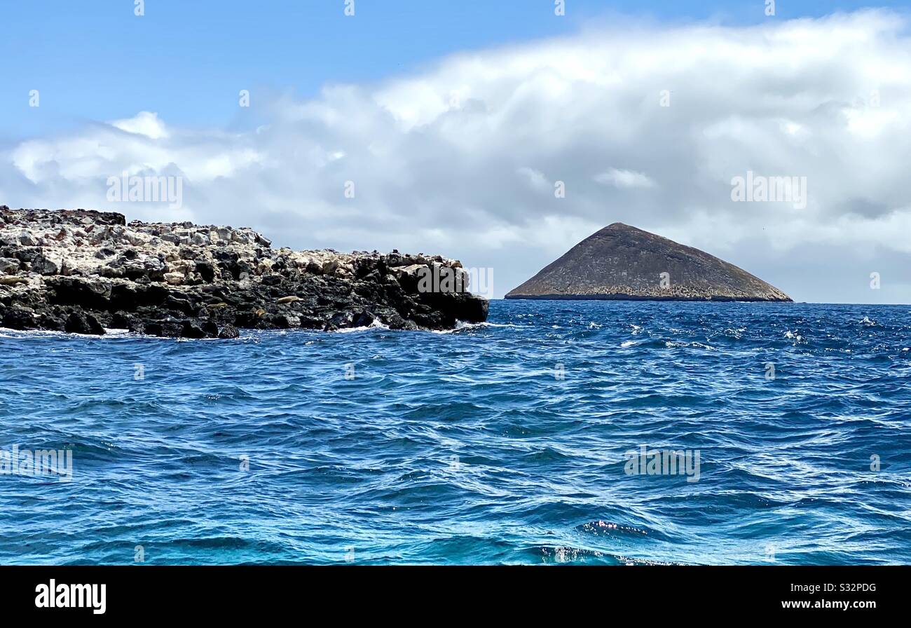 Volcanic cone off the coast of Floreana Island, Galápagos Islands. Stock Photo