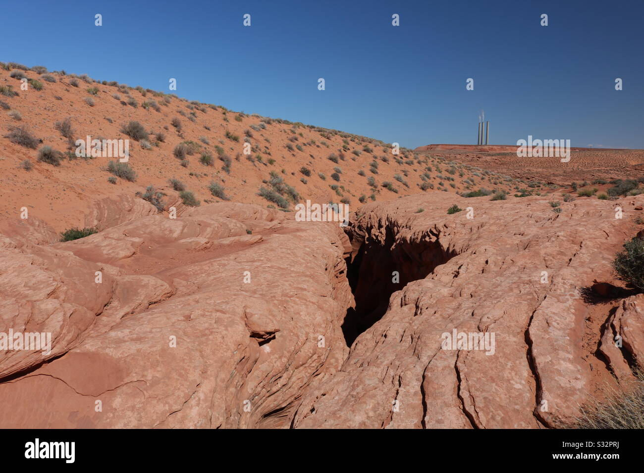 Above a slot canyon in Navajo Nation, AZ Stock Photo