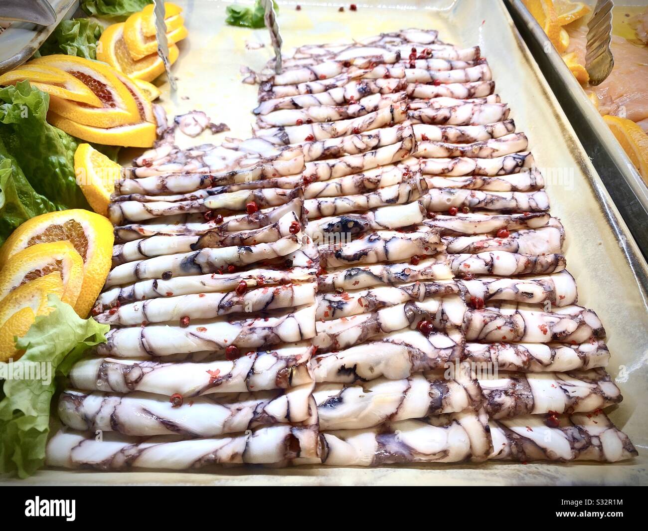 Tasty octopus carpaccio Stock Photo