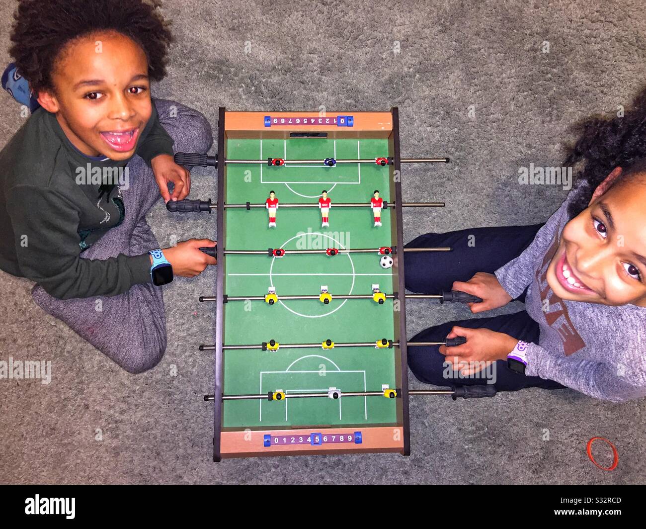 Kids planting table football - Smartphone Captured Stock Image