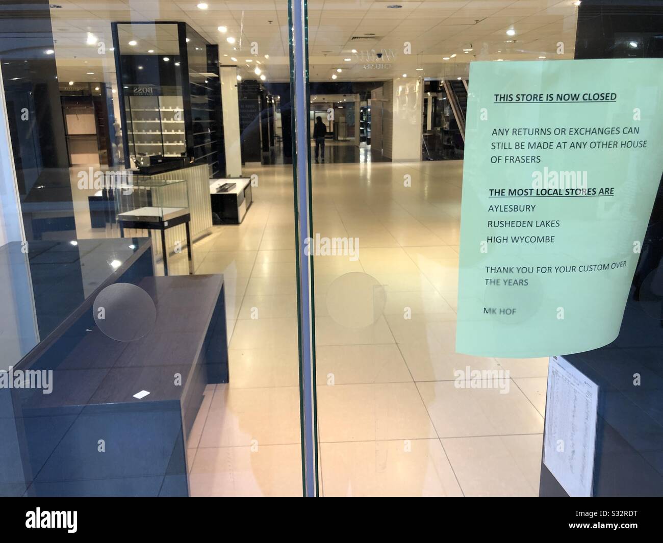 Another casualty of the crisis in the UK High Street. The Milton Keynes branch of House of Fraser closes a month after Christmas 2019 with just a few display cabinets left in a nearly empty shop. Stock Photo