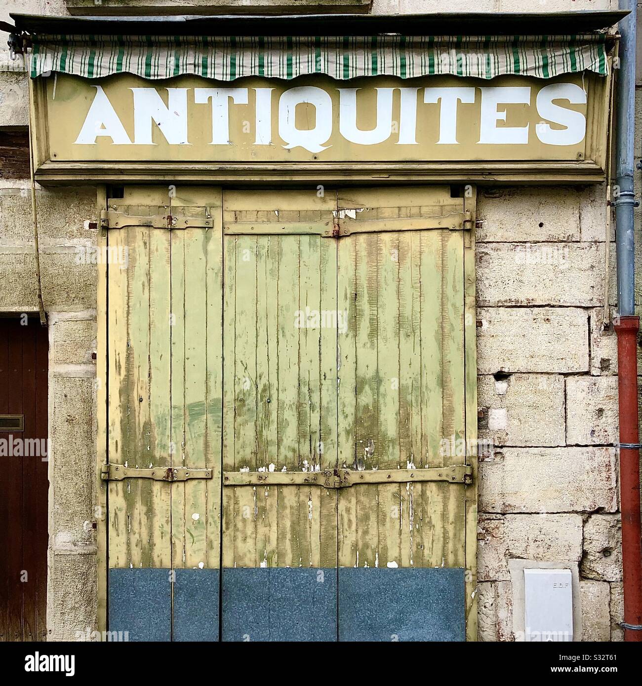 Closed antique shop in France. - Smartphone Captured Stock Image