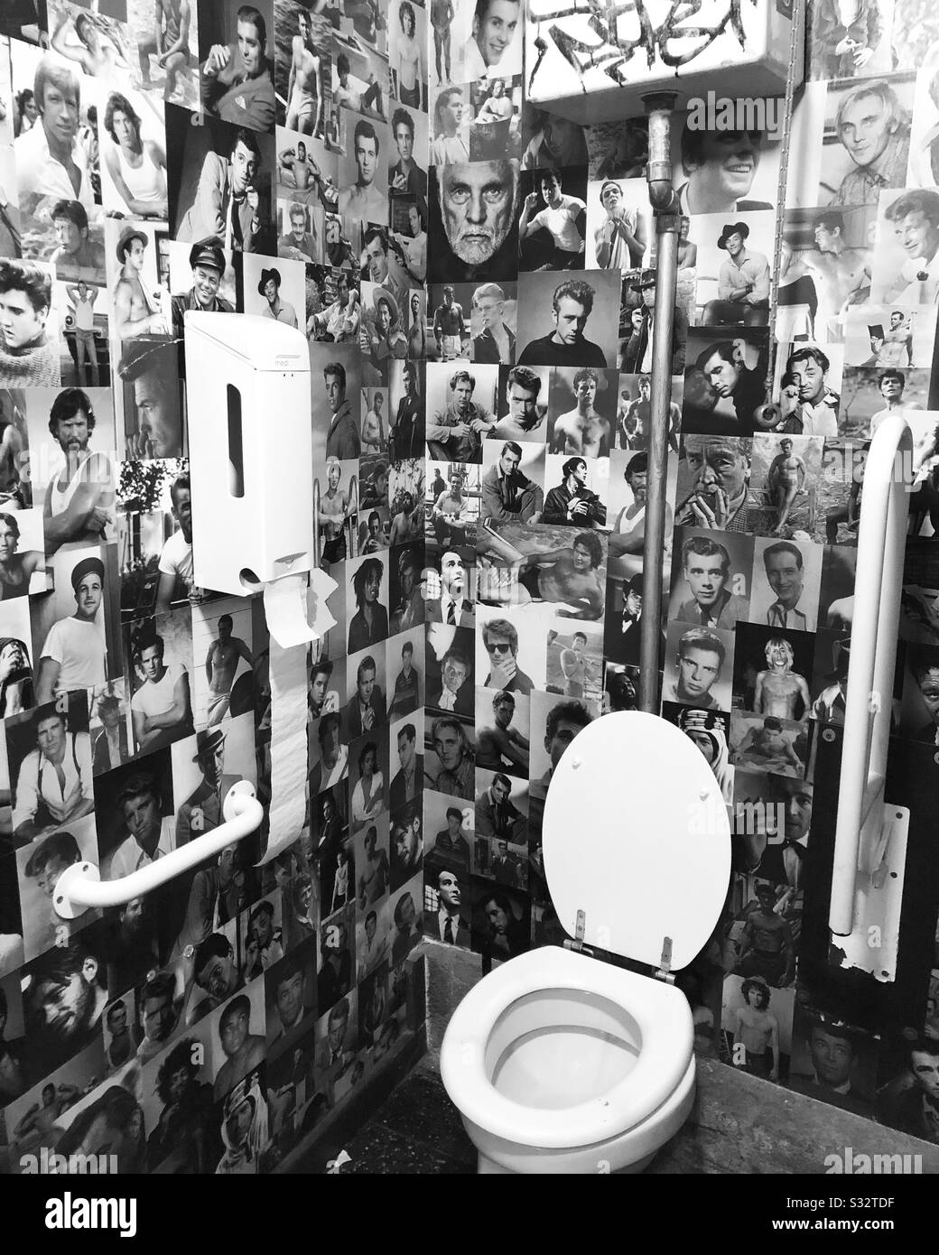 A bathroom decorated with celebrity photos - Smartphone Captured Stock Image