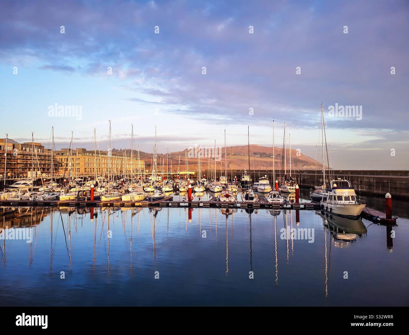 Winter morning at Greystones Harbour Marina with new apartments aside