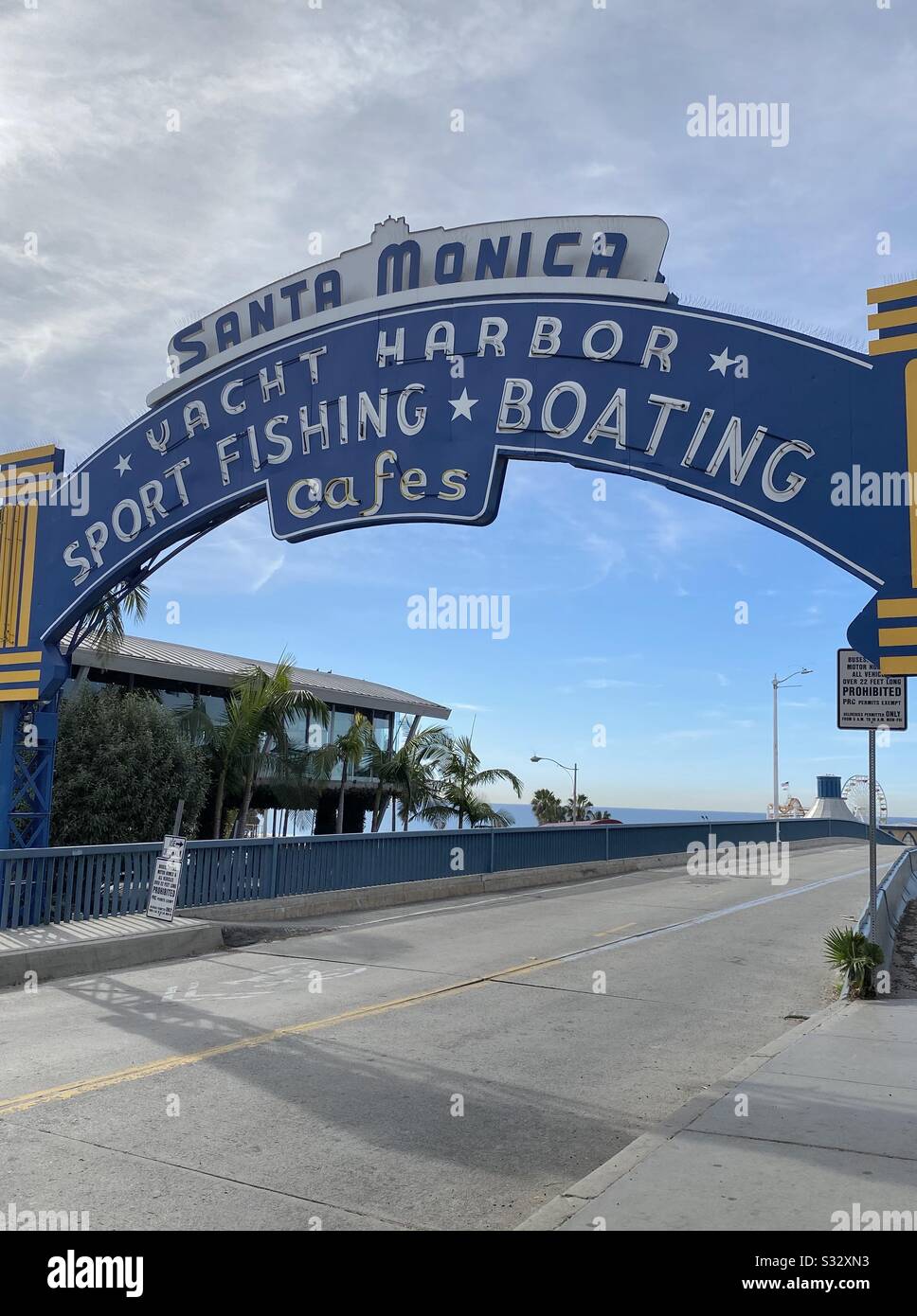 Street view of sign leading into the Santa Monica Pier Stock Photo