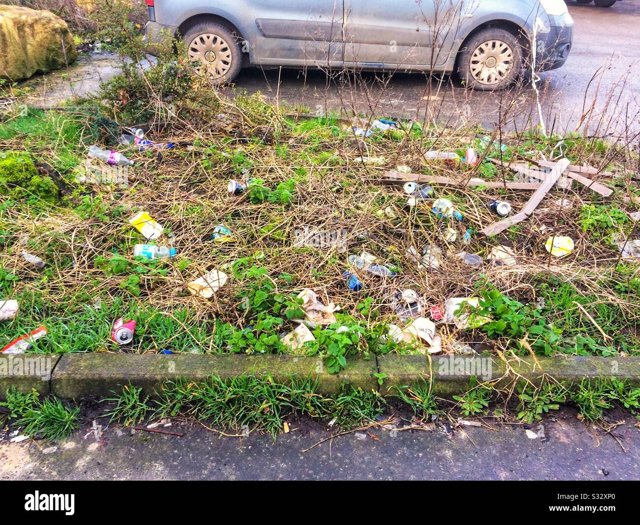 Discarded litter outside UK motorway service station. England, UK - Smartphone Captured Stock Image