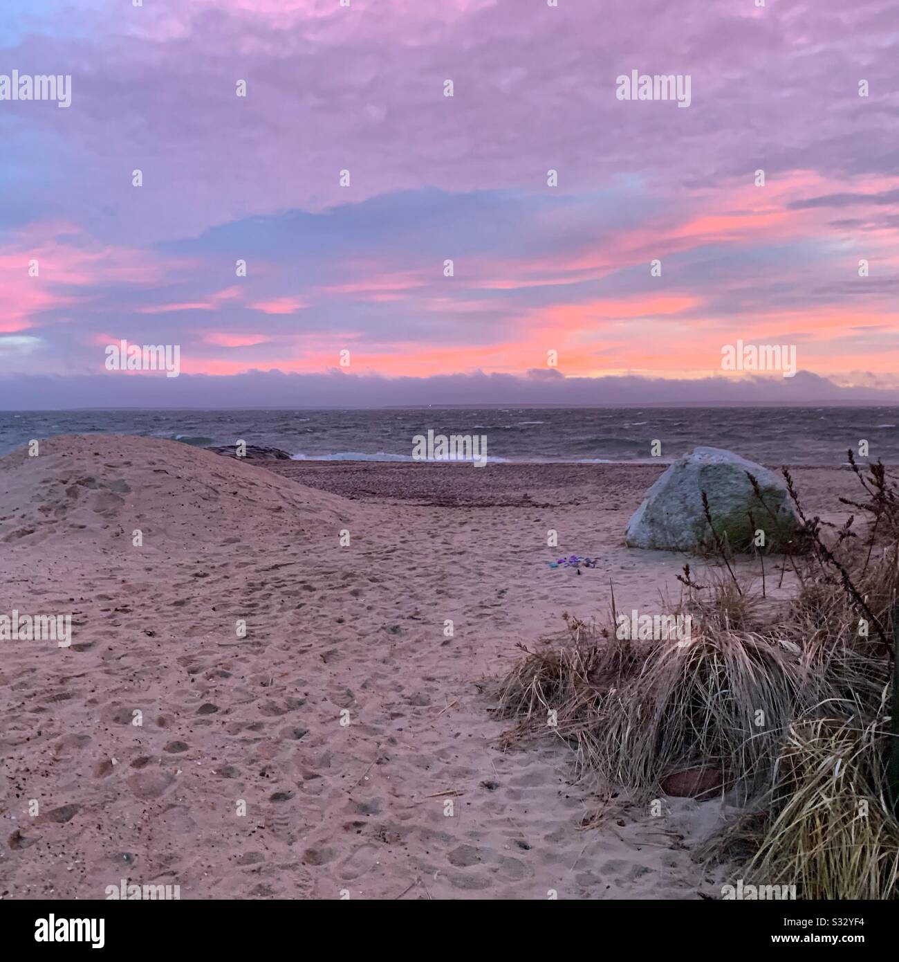 Sunset in winter on a beach in Falmouth, Cape Cod, Massachusetts, United States - Smartphone Captured Stock Image