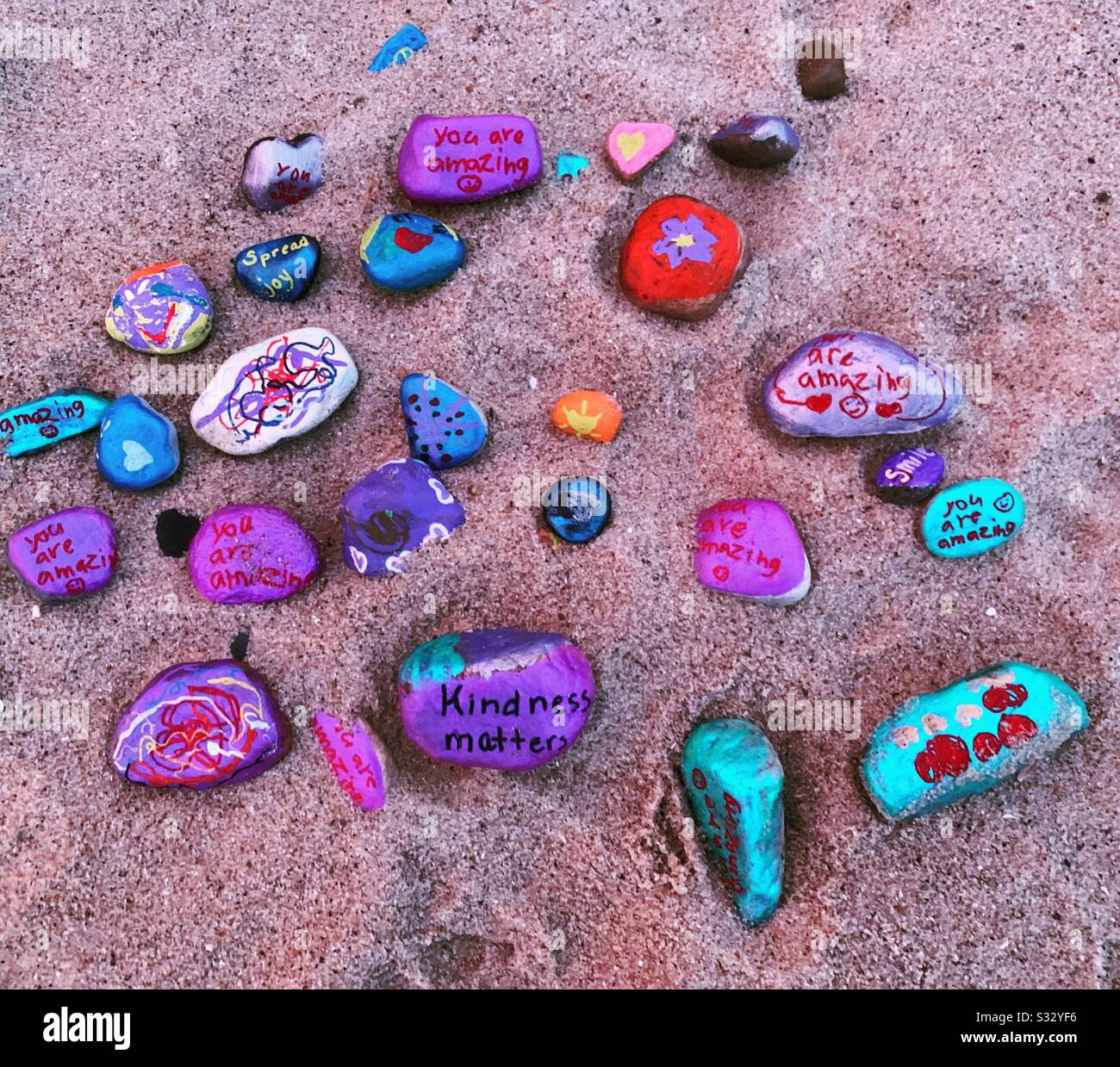 Colorful painted rocks on a beach in Falmouth, Cape Cod, Massachusetts, United States - Smartphone Captured Stock Image