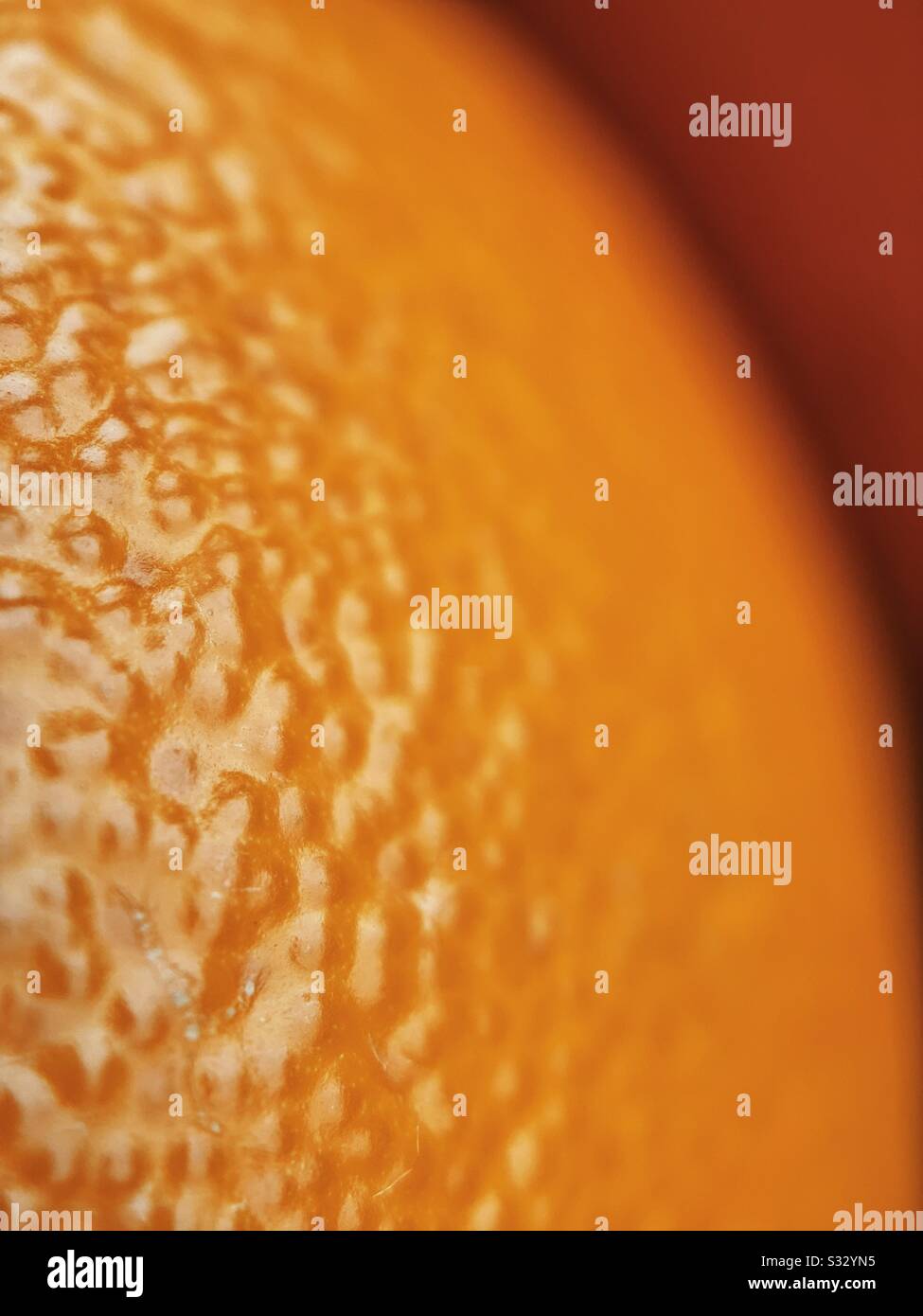 Macro photo of orange with another in the background - Smartphone Captured Stock Image