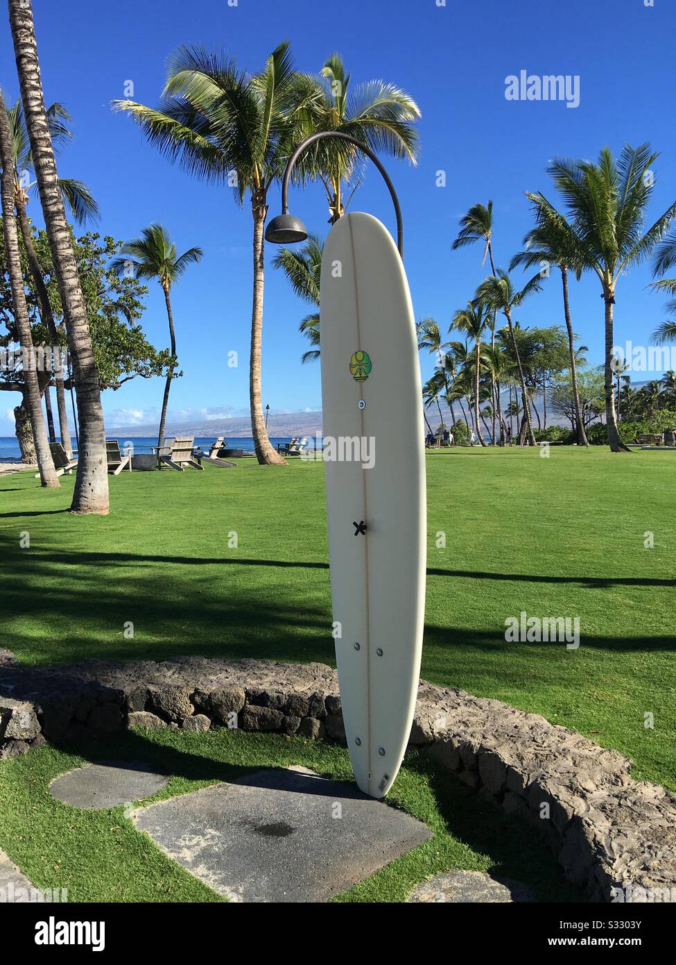 Surfboard outdoor shower at Mauna Lani Resort by Auberge near Puako on the Kohala Coast of the Big Island of Hawaii - Smartphone Captured Stock Image