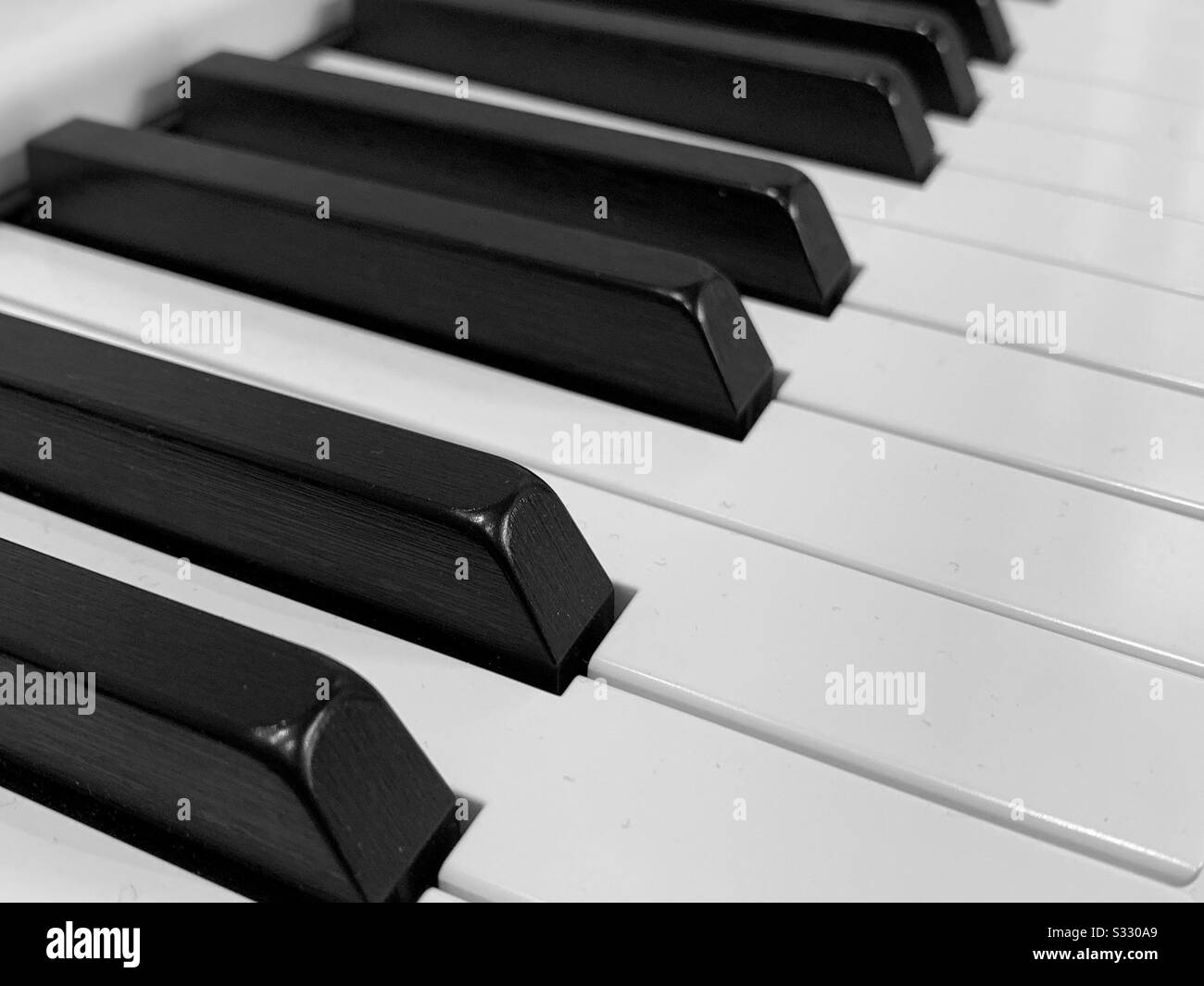 Black and white piano keys.  Keyboard close up Stock Photo