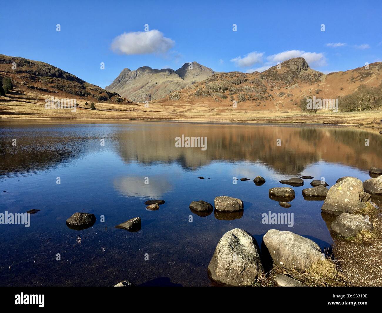A lovely day at Blea Tarn, Little Langdale, Cumbria. Calm before storm Ciara is due to batter the UK with 80 mph winds at the weekend. Stock Photo
