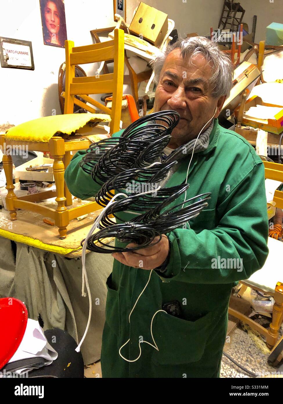 Italian Artisan traditional Italian upholstery skill portrait in his