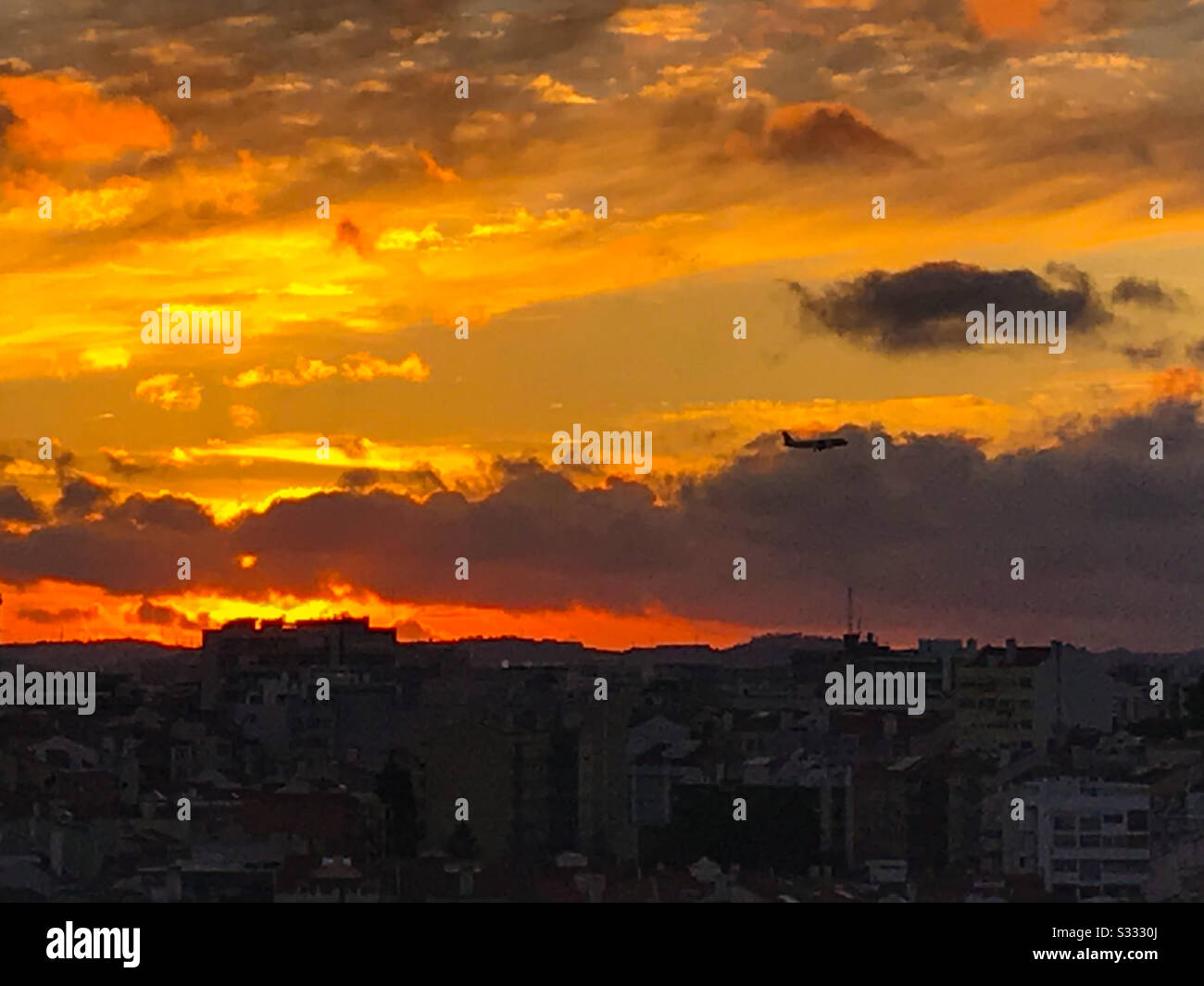 Plane in flight at sunset Lisbon - Smartphone Captured Stock Image