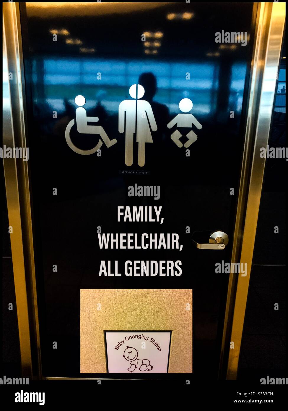Baby changing station in a toilet for all genders. All inclusive. For everyone. One and all. Words. Images. - Smartphone Captured Stock Image
