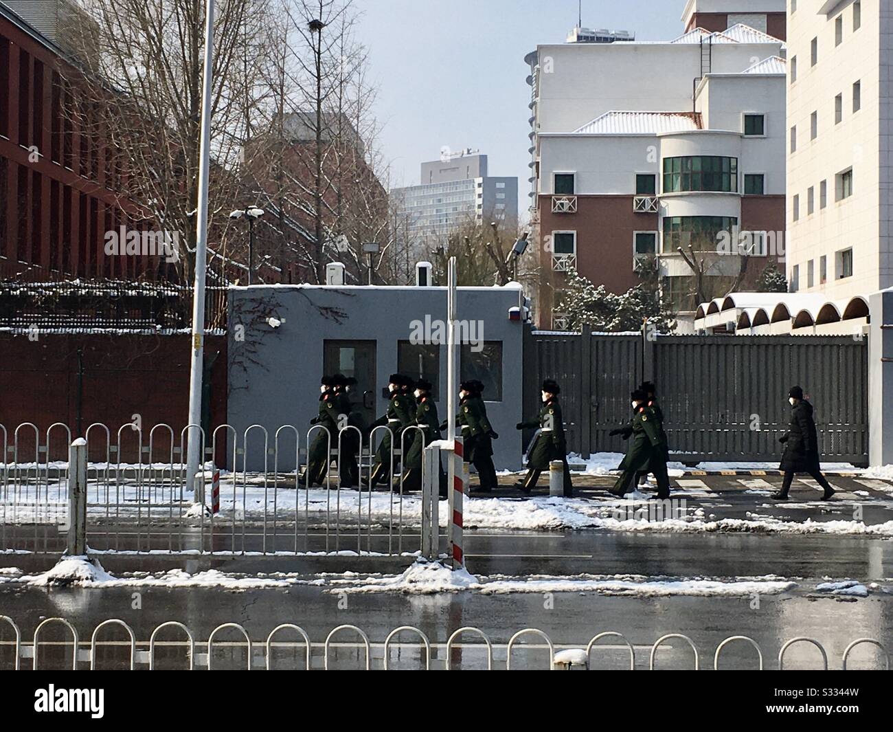 Beijing, China - February 7, 2020: Chinese military officers wearing masks on the streets during coronavirus outbreak. Tianze Road, Chaoyang district, Beijing, China. - Smartphone Captured Stock Image