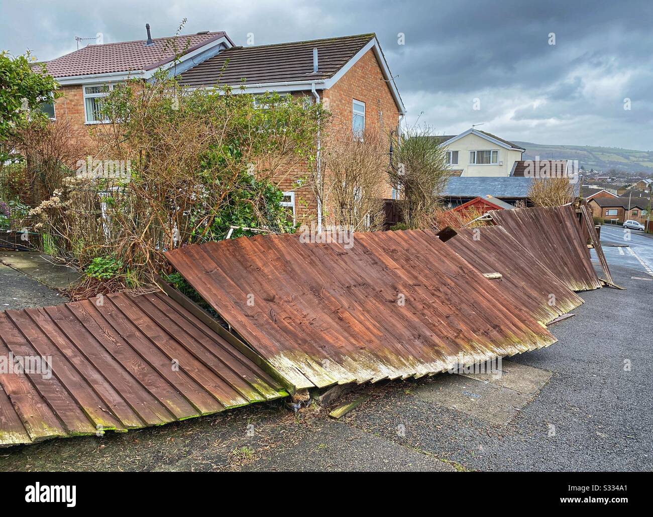 Garden fence completely destroyed by a winter storm - Smartphone Captured Stock Image