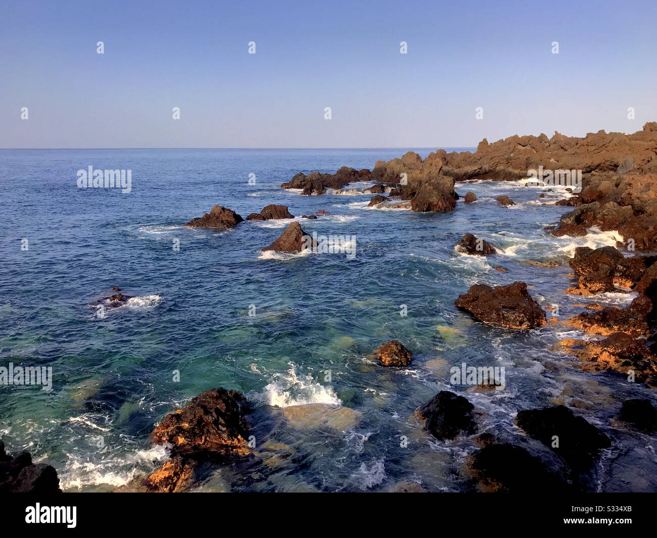 Seascape with volcanic rocks on the west coast of Tenerife, Canary Islands - Smartphone Captured Stock Image