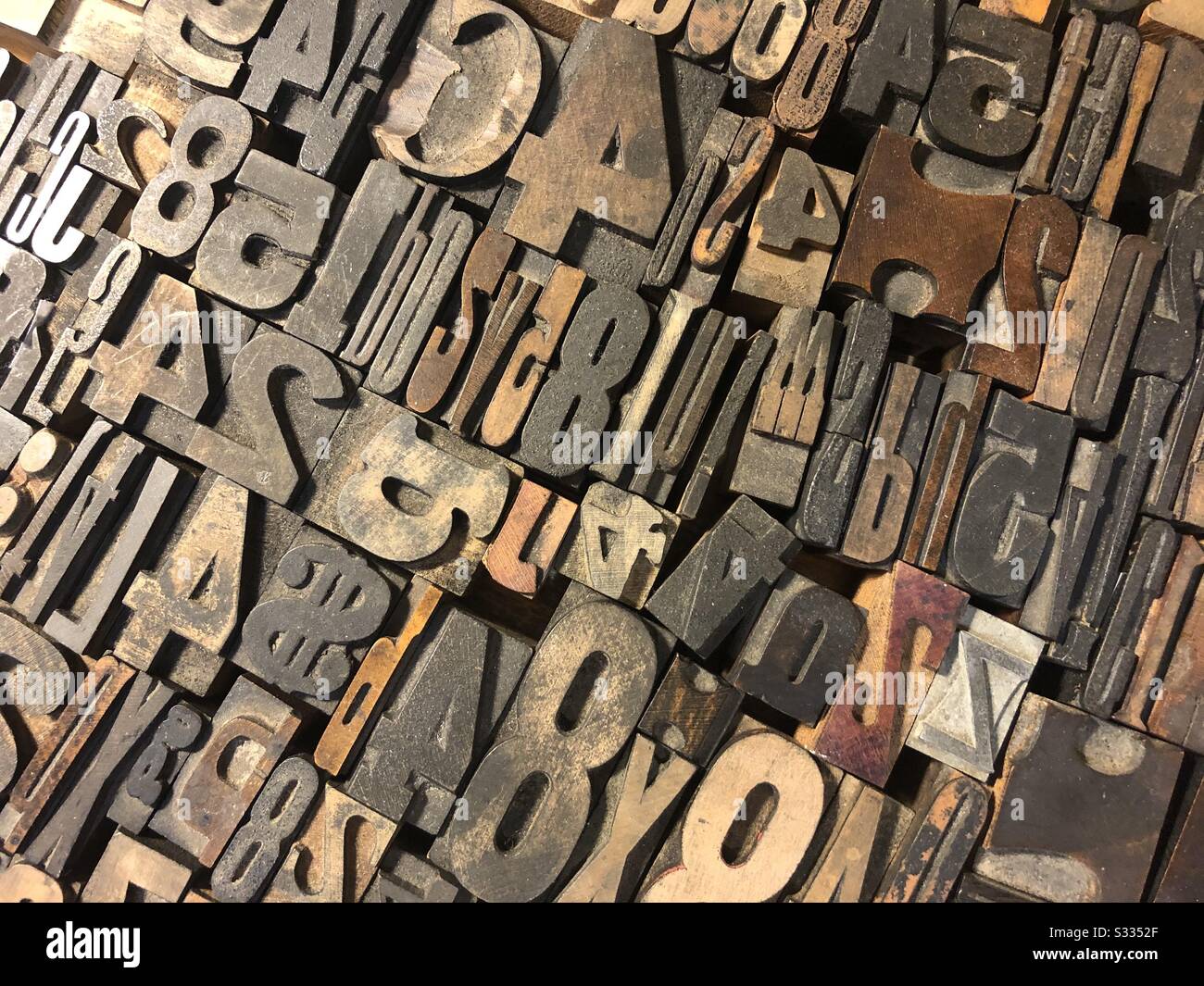 Assortment of antique typeset letters and numbers Stock Photo