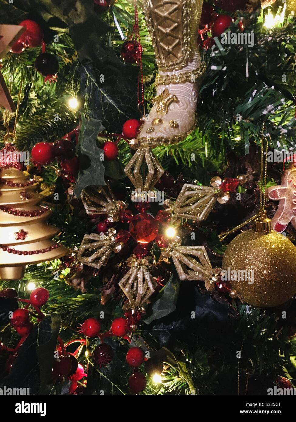 Victorian Themed Christmas Decorations As A Background For Greeting Cads Tags Gift Wrap Or Publications Red Gold And Green With Twinkling Lights Stock Photo Alamy