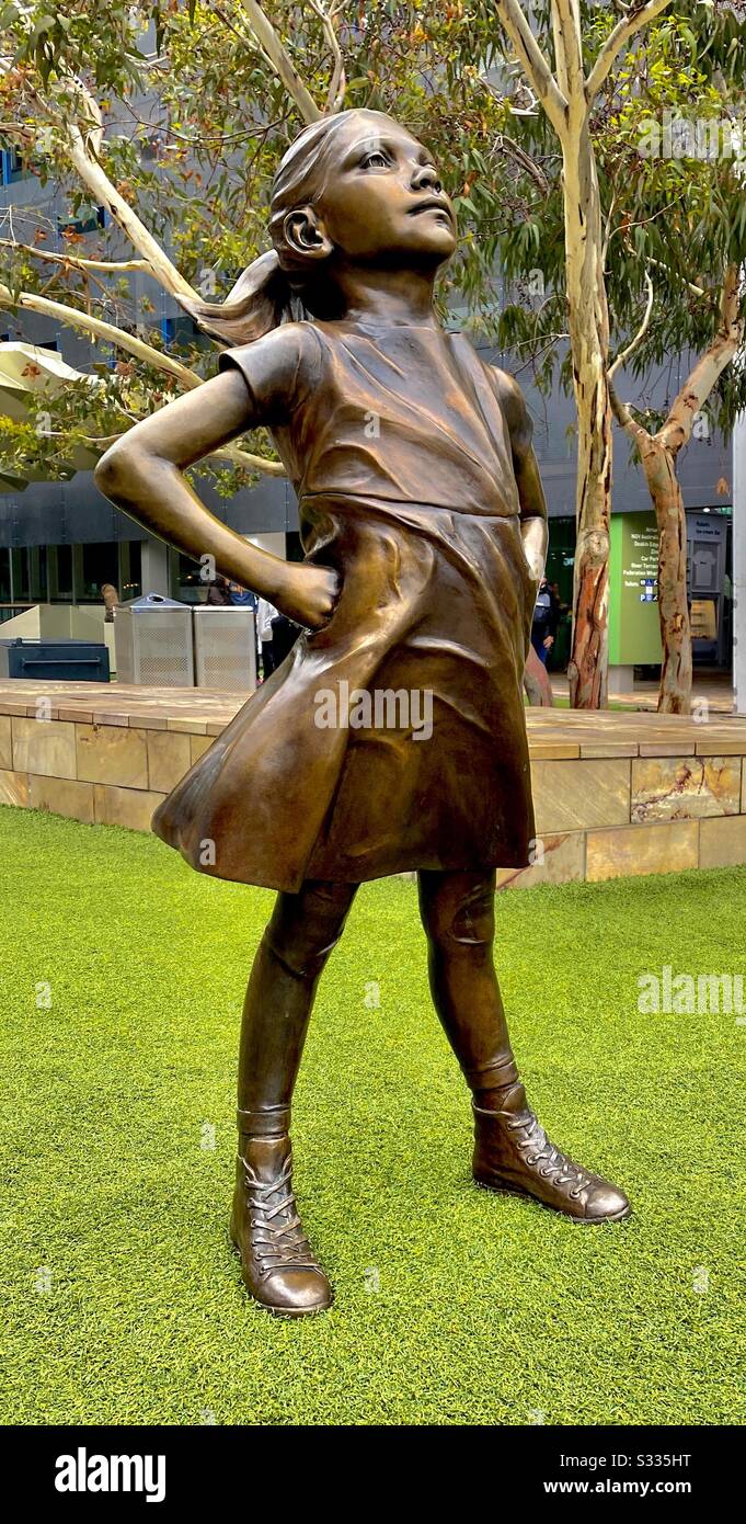 “Fearless Girl” by sculptor Kristen Visbal standing in Federation Square, Melbourn. The original debuted on International Women’s Day 2017 in New York, this reproduction was unveiled in 2019 Stock Photo