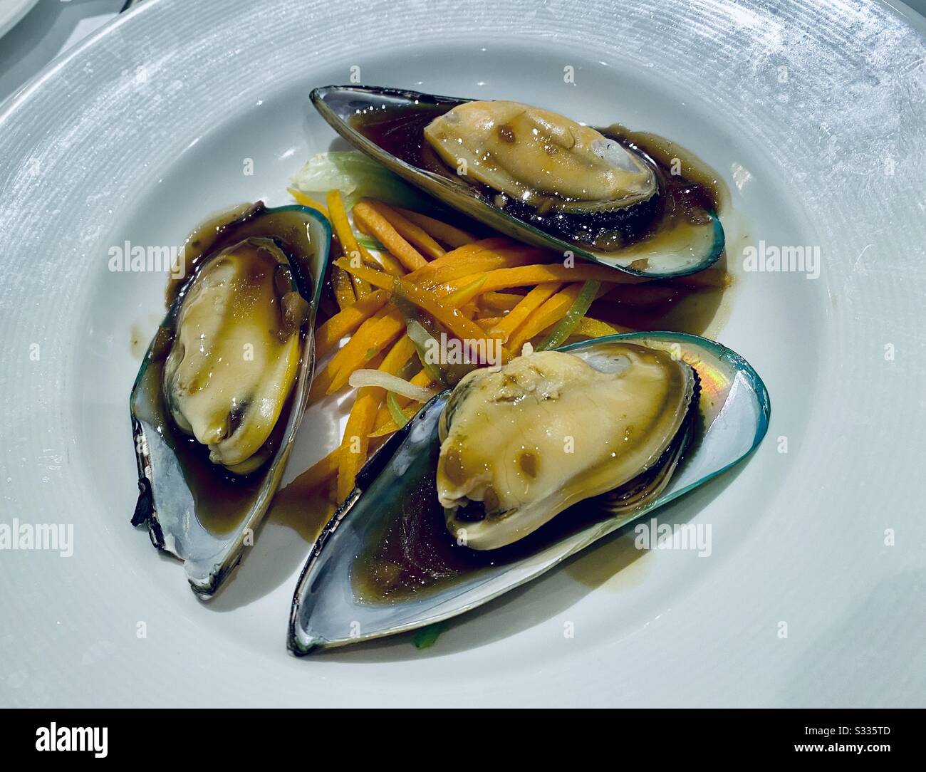 Freshly cooked New Zealand Mussels in ponzu sauce - Smartphone Captured Stock Image