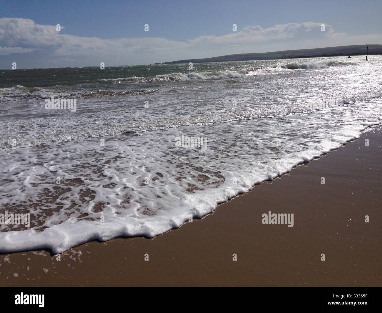 Sea foam on the beach Stock Photo Alamy