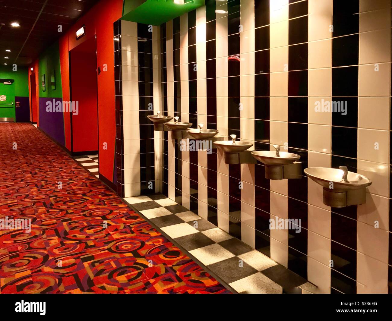 Water Fountains Black And White Tiles And Colorful Decor At Movie Theater Stock Photo Alamy