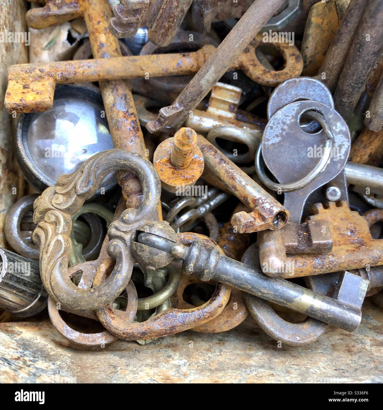 Jumble mass of antique and modern keys for sale at flea market Bologna Italy - Smartphone Captured Stock Image