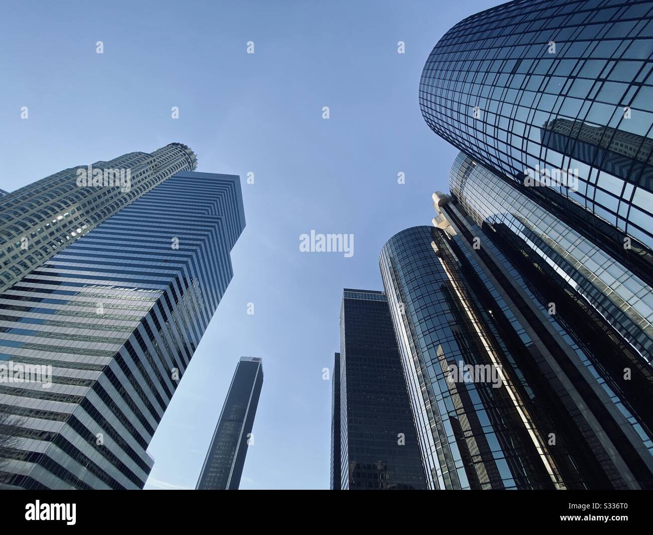 LOS ANGELES, CA, JAN 2020: looking up at hotel and office windows of skyscrapers in the Financial District of Downtown - Smartphone Captured Stock Image