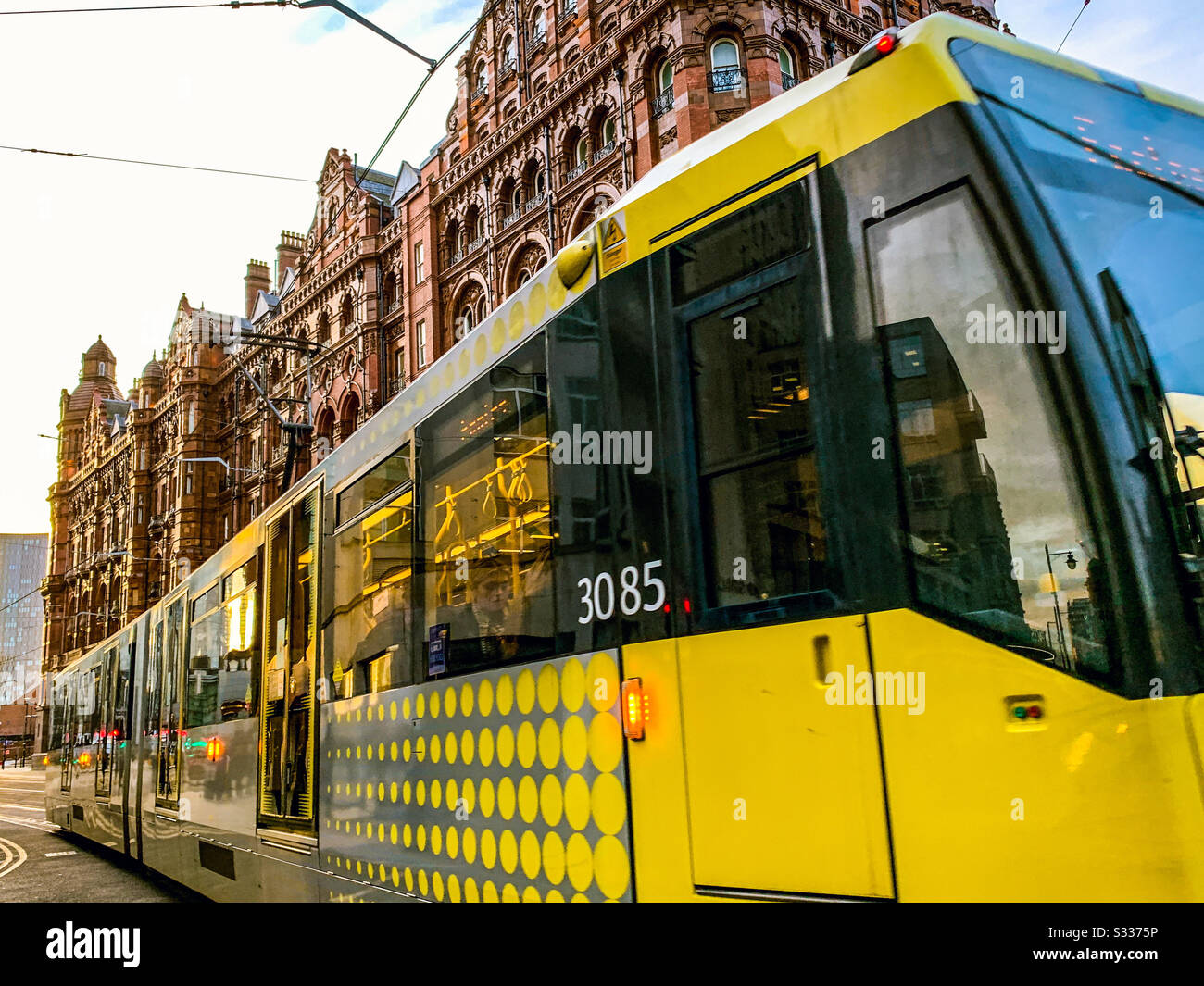 Metrolink tram passing the Midland hotel in Manchester City centre - Smartphone Captured Stock Image