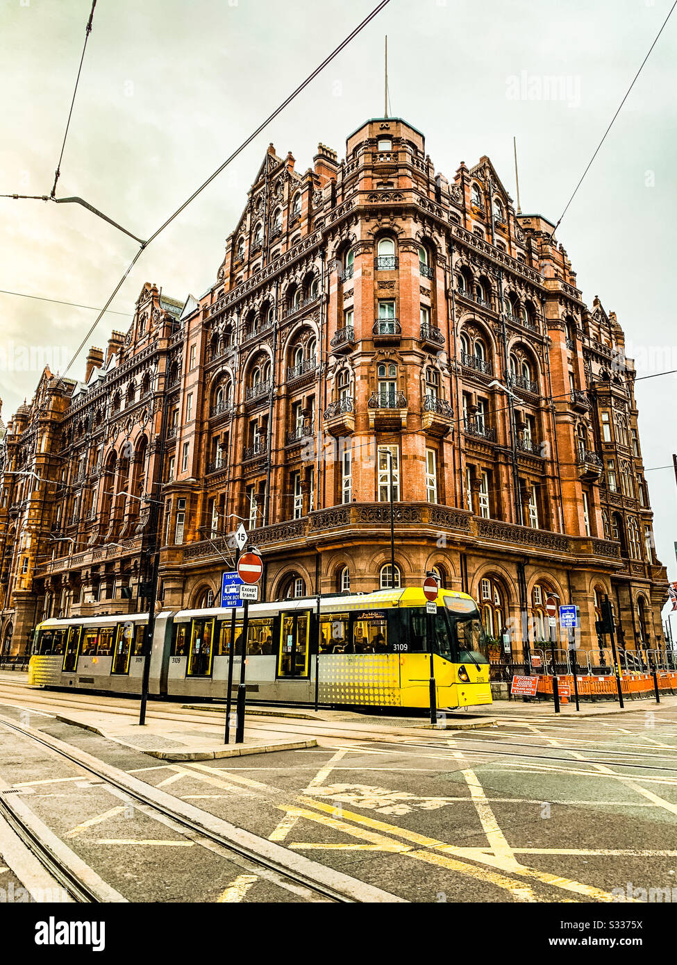 Metrolink tram passing the midland hotel in Manchester City centre - Smartphone Captured Stock Image