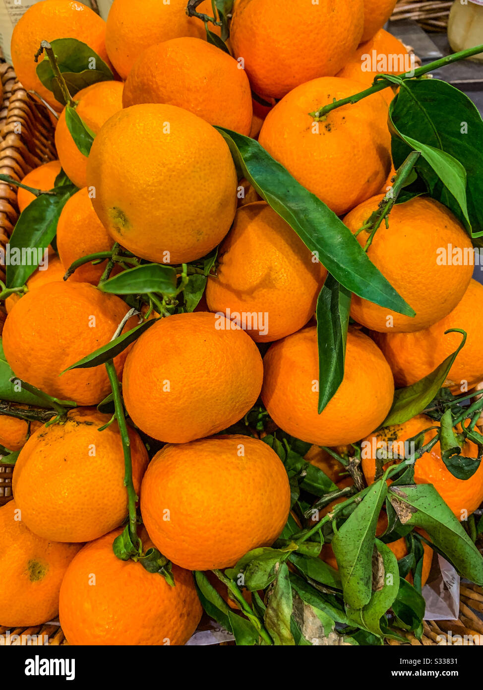 Oranges in basket Stock Photo
