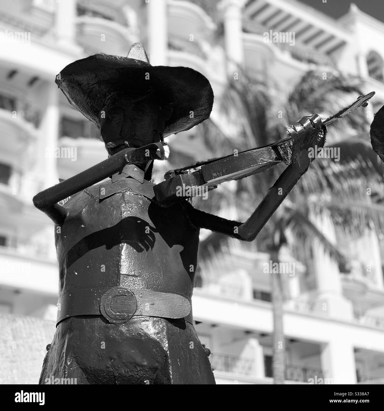 Black and white image of one of the Mariachi statues at the pool, Hyatt Zilara Resort, Cancun, Quintana Roo, Mexico - Smartphone Captured Stock Image