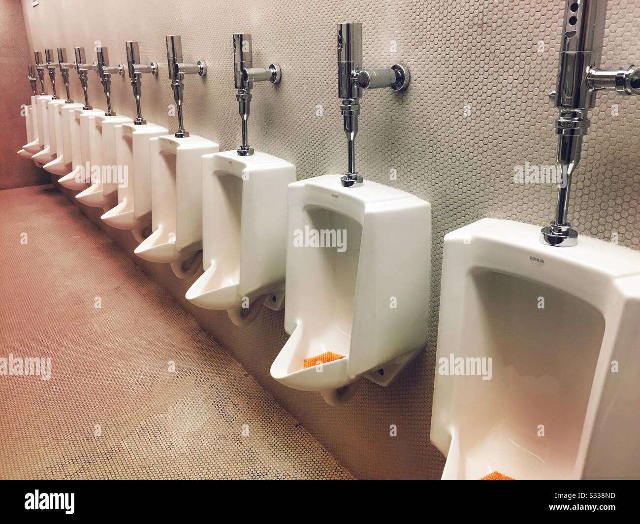 A row of urinals in a men’s laboratory in New York City, USA Stock