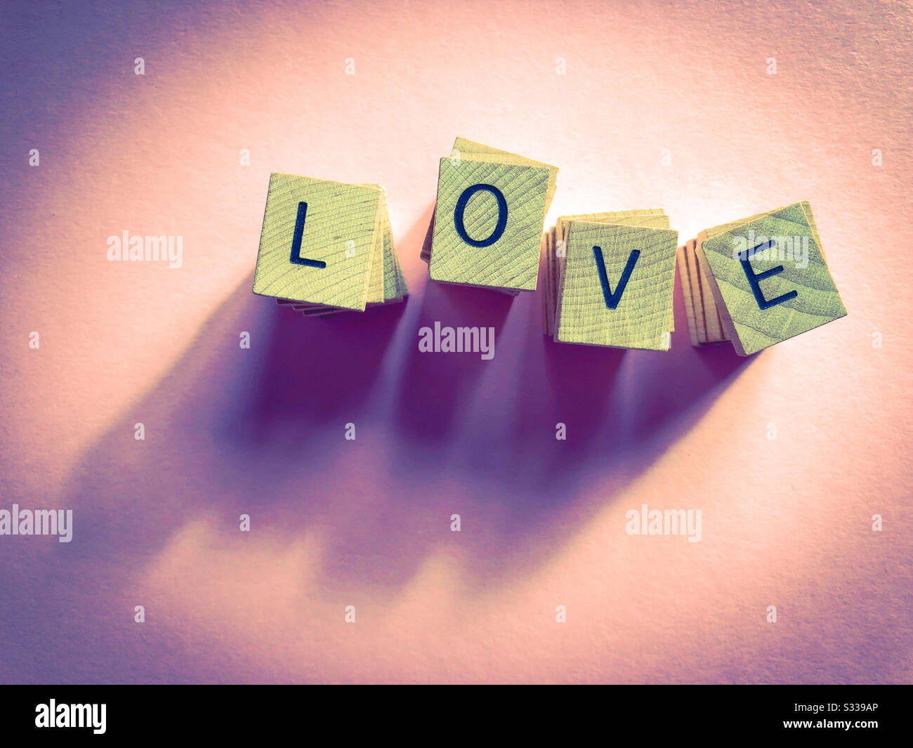 Love, in alphabet letters piled high, with copy space Stock Photo
