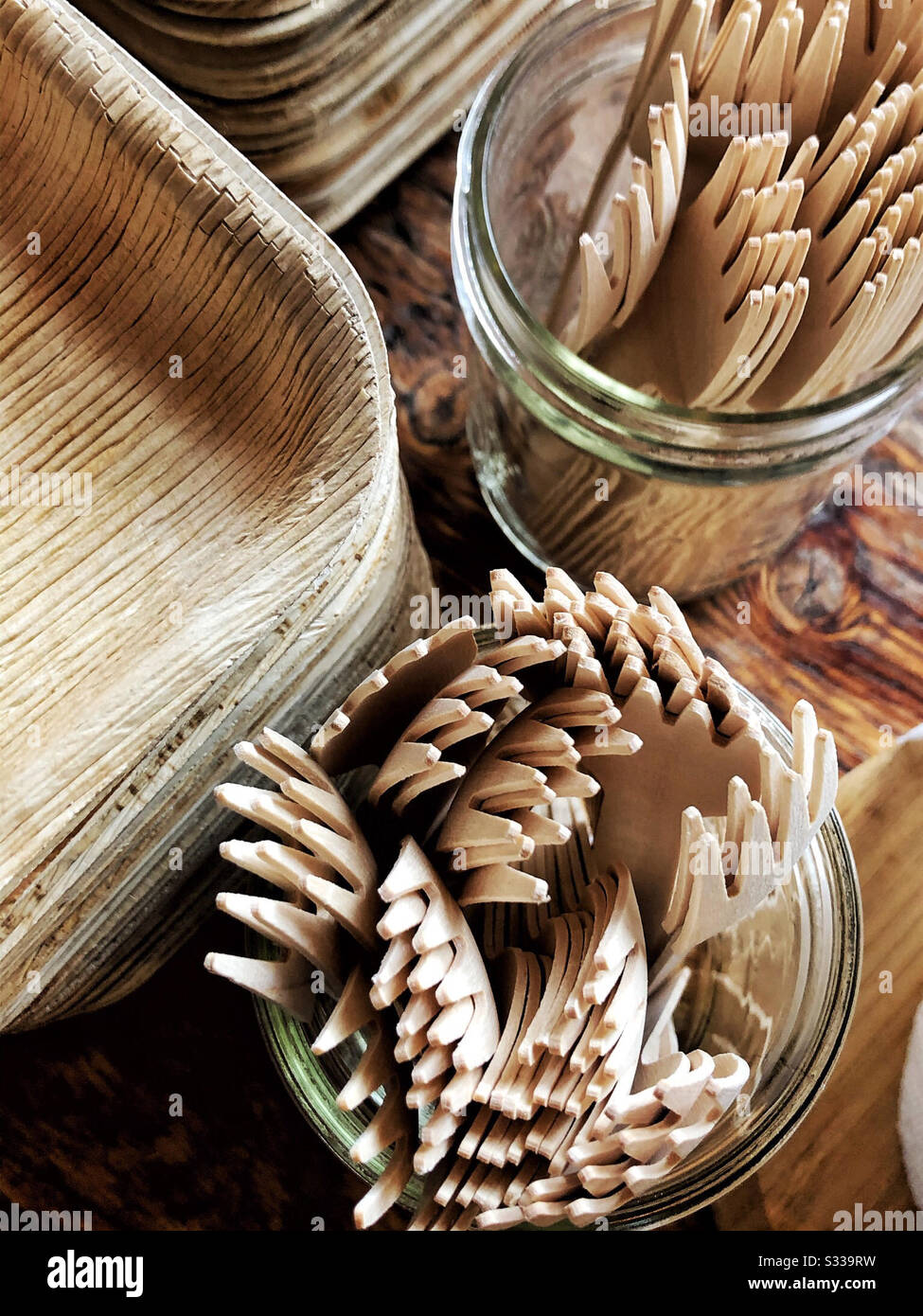 Bamboo cutlery and plates at party  sustainable and recyclable - Smartphone Captured Stock Image