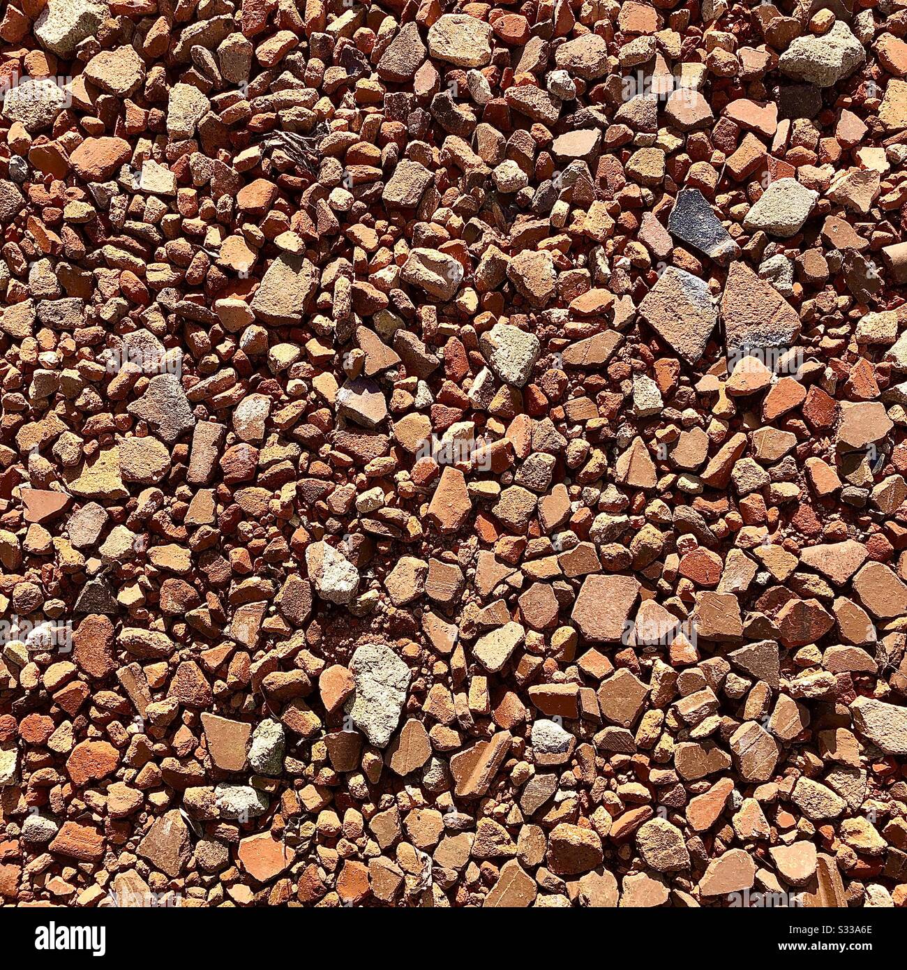 Broken red brick and tile driveway foundation. Stock Photo