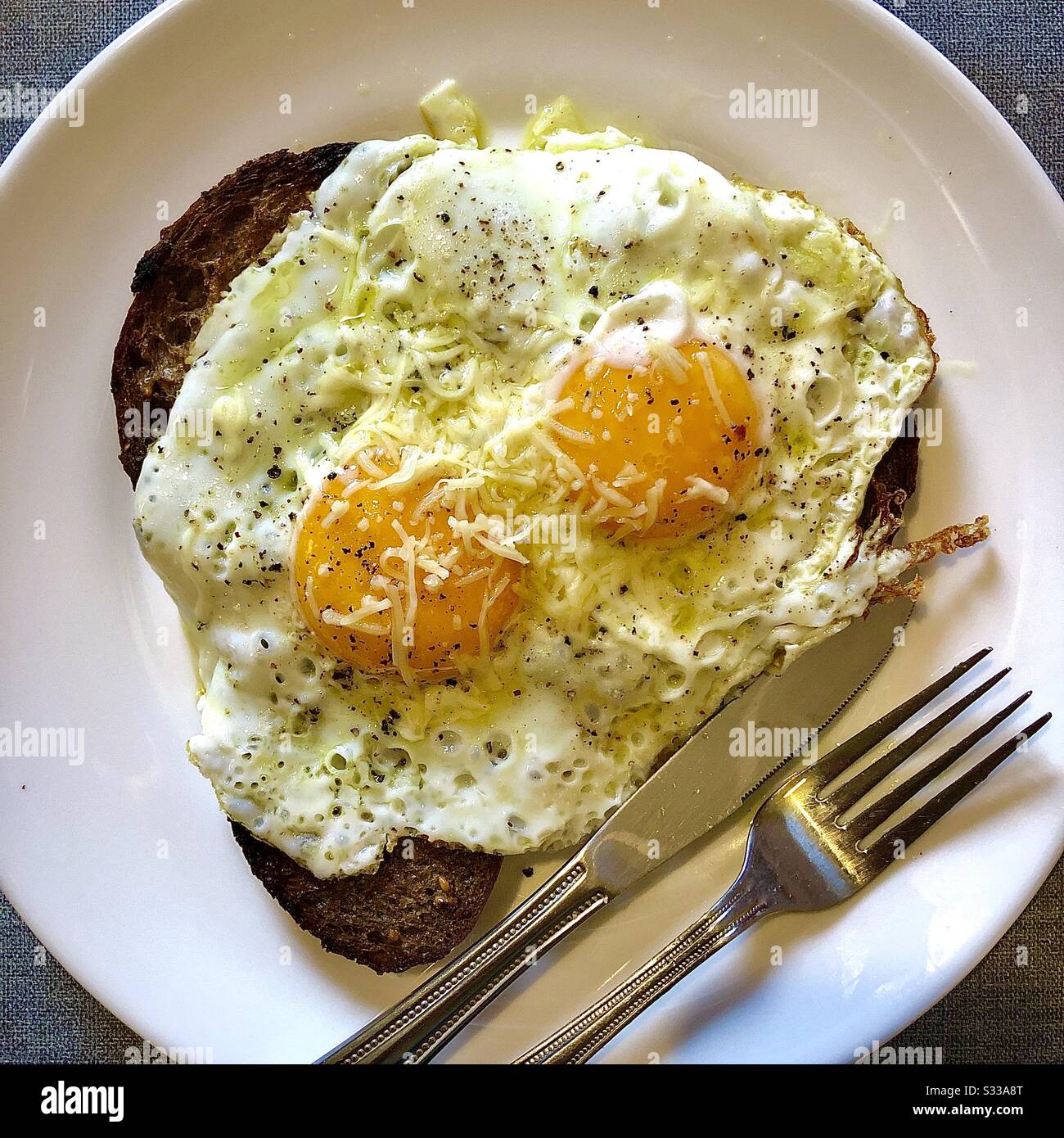 Fried eggs on fried bread snack. Stock Photo