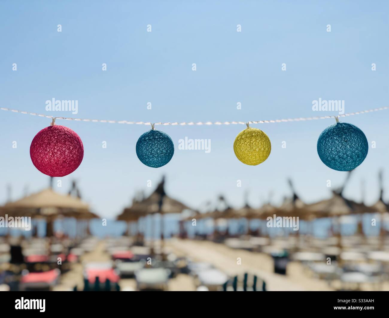 Colorful round decorations on the beach - Smartphone Captured Stock Image