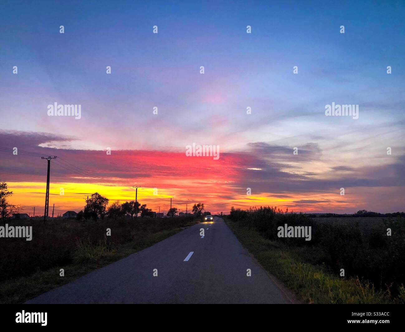 Amazing sunset on the road - Smartphone Captured Stock Image