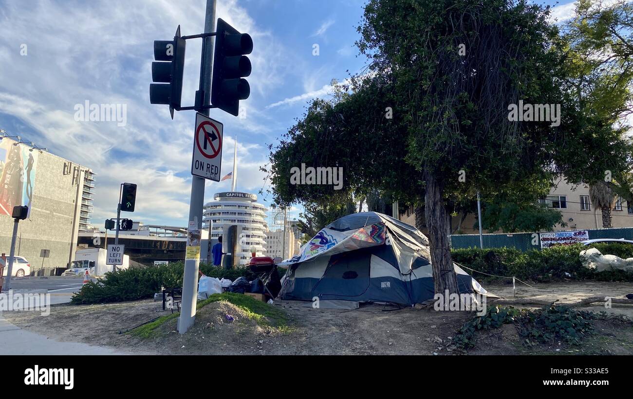 LOS ANGELES, CA, JAN 2020: wide view homeless tent at the side of a street in Hollywood. Capital Records building in background Stock Photo