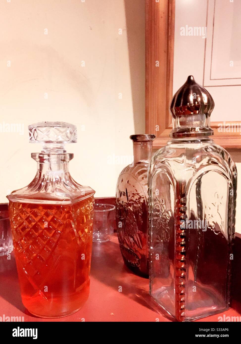 Decanters at an upscale residential bar set up Stock Photo