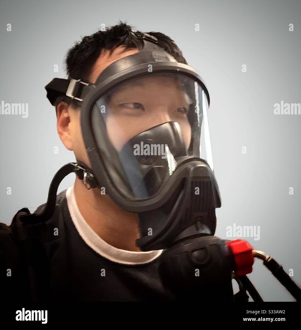 Chinese man in gas mask Stock Photo